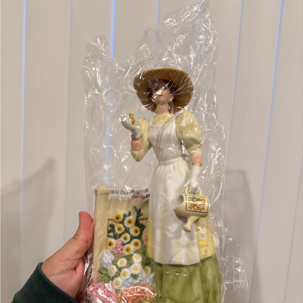 Avon Collectible Figurine with White and Green Accents